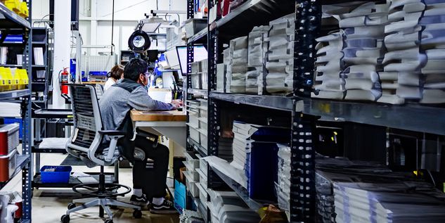 Warehouse Worker at desk