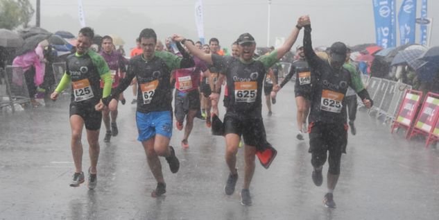 Team at the finish line in the rain